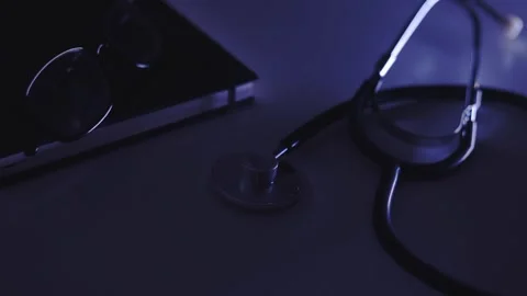 Stethoscope, diary, glasses lie on a white background Stock Footage 244599349
