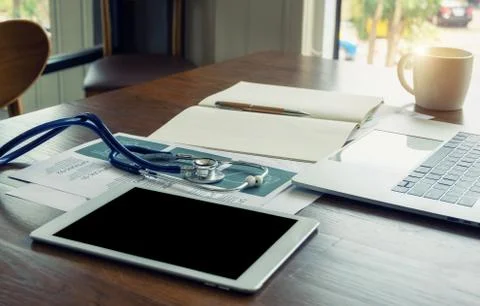 Stethoscope on the doctor's desk. Stock Photos