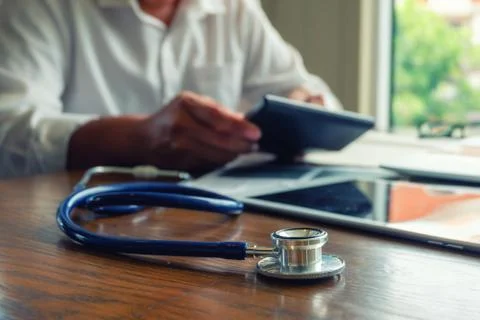 Stethoscope on the doctor's desk. Stock Photos