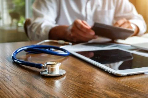 Stethoscope on the doctor's desk. Stock Photos