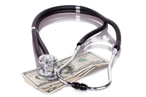 Stethoscope on dollars Stock Photos