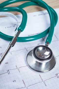 Stethoscope on an electrocardiogram (ECG) chart background Stock Photos