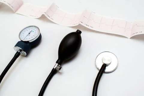 Stethoscope on the electrocardiogram graph Stock Photos