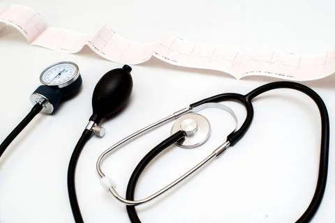 Stethoscope on the electrocardiogram graph Stock Photos