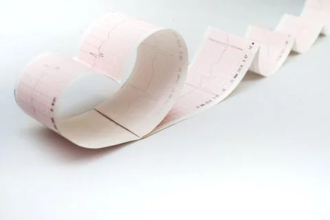 Stethoscope on the electrocardiogram graph Stock Photos