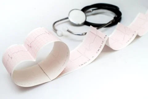 Stethoscope on the electrocardiogram graph Stock Photos