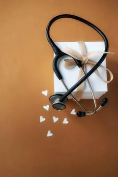 Stethoscope on a gift box Stock Photos