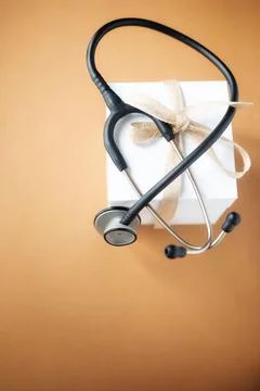 Stethoscope on a gift box Stock Photos