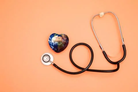 Stethoscope with globe on a red background.Headline Stock Photos