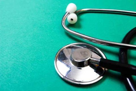 Stethoscope  on green background Stock Photos