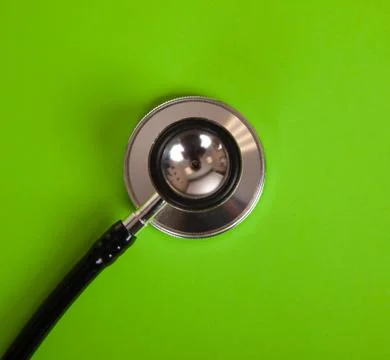 Stethoscope on green background Stock Photos
