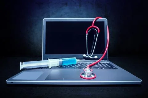 Stethoscope on laptop Stock Photos
