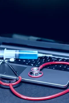 Stethoscope on laptop Stock Photos