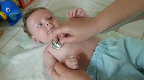 Stethoscope Listening To A Baby Heart Beat Stock Footage 64351187