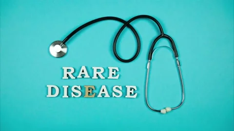 Stethoscope moving on a blue background shows words rare diseases Stock Footage 161433327
