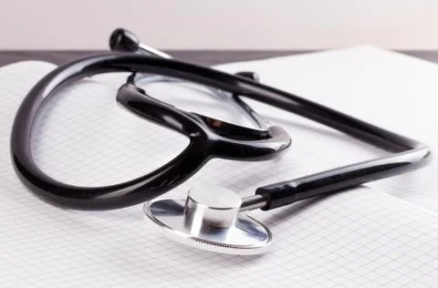 Stethoscope on a notepad Stock Photos