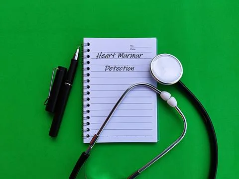 Stethoscope pen and note written Heart Murmur Detection on green background Stock Photos