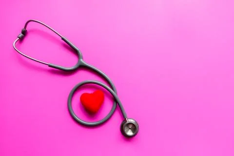 Stethoscope on a pink background with space for text. Fotos de archivo