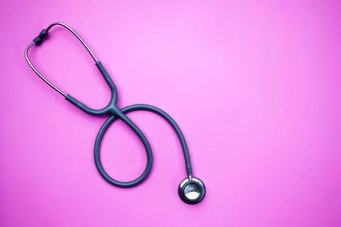 Stethoscope on a pink background with space for text. Stock-Fotos