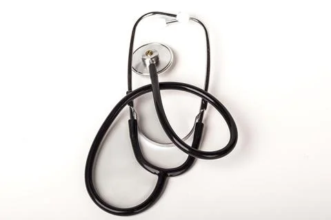 Stethoscope placed on a flat surface ready for use in a medical setting Stock Photos