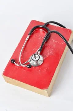 Stethoscope on red old book 写真素材