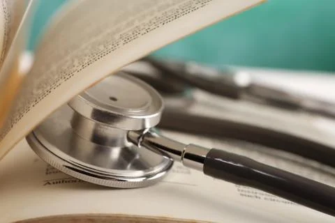 Stethoscope resting on the book Stock Photos
