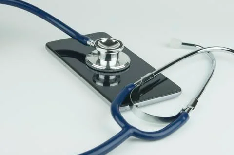 Stethoscope on the smartphone. Stock Photos