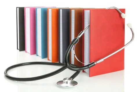 Stethoscope with a stack of books isolated on white Stock Photos
