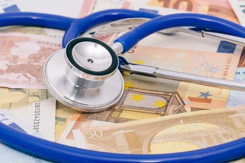 Stethoscope on a stack of euro bank notes Stock Photos