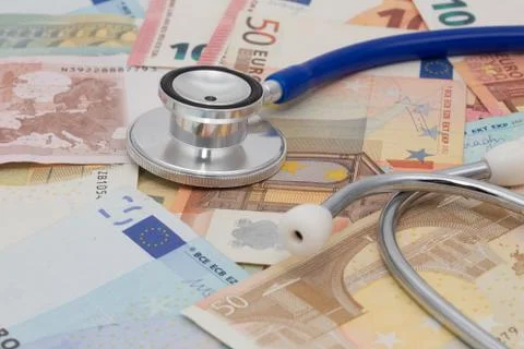 Stethoscope on a stack of euro bank notes Foto stock