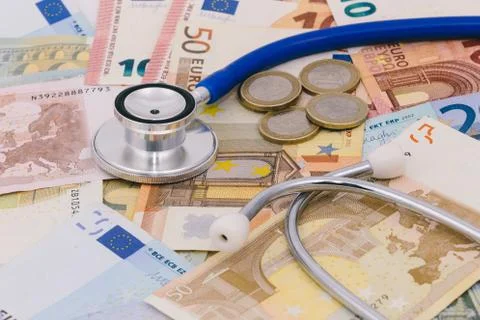 Stethoscope on a stack of euro bank notes Stock Photos