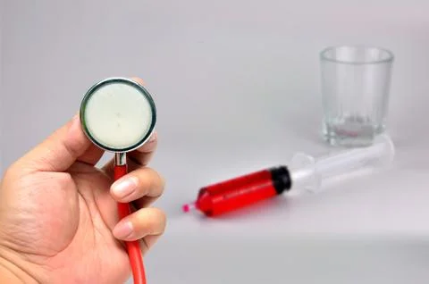 Stethoscope with syringe Stock Photos
