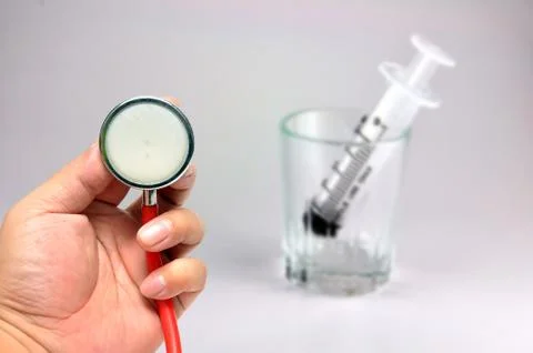 Stethoscope with syringe Foto stock