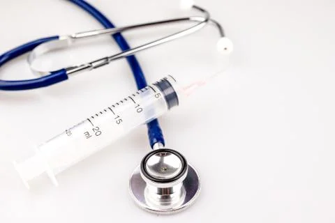 Stethoscope with syringe Stock Photos