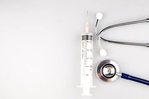 Stethoscope with syringe Stock Photos