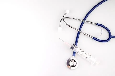 Stethoscope with syringe Stock Photos