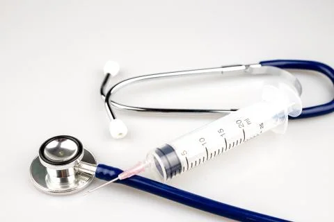 Stethoscope with syringe Stock Photos