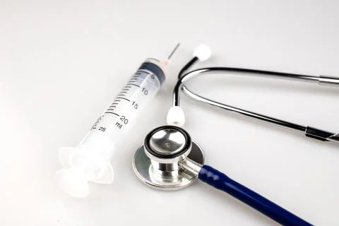 Stethoscope with syringe Stock Photos