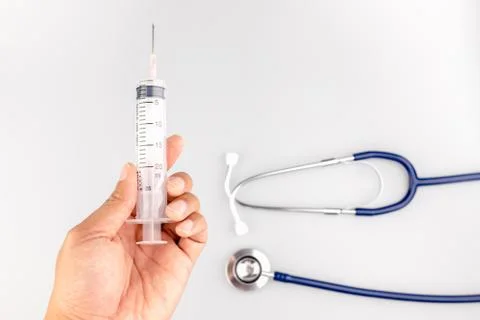 Stethoscope with syringe Stock Photos