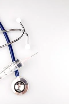 Stethoscope with syringe Stock Photos