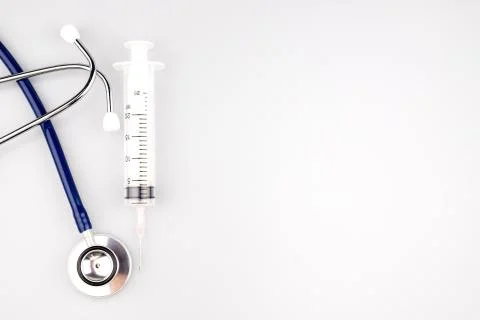 Stethoscope with syringe Stock Photos