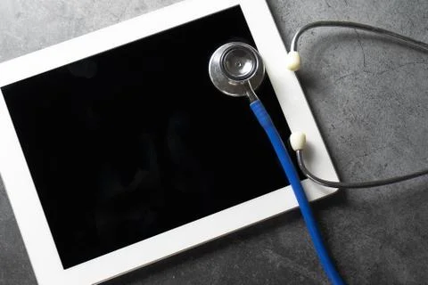 Stethoscope With Tablet On Floor Foto stock