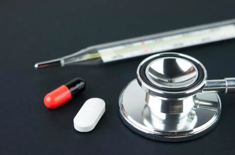 Stethoscope, Thermometer and Tablets. Stock Photos