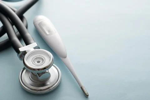 Stethoscope with thermometer on a white background Stock Photos