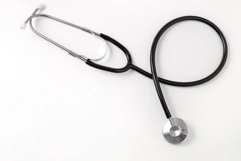 Stethoscope on white background, top view. Medical tool. Copy space, free spa Stock Photos