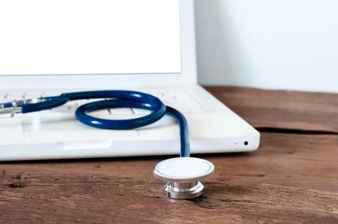 The stethoscope with white laptop computer on desk for working Stock Photos