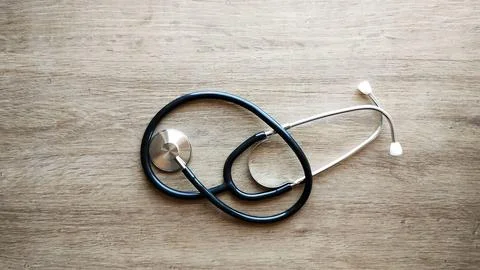 Stethoscope on a wooden surface Stock Photos