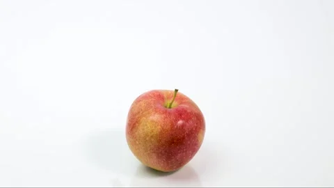 A stethoscope wraps a ripe red apple Stock Footage 184469610
