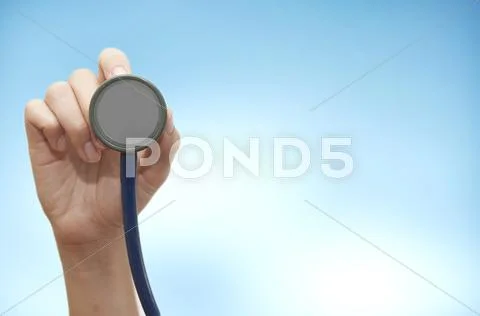 Stethoscope in young female doctor hand Stock Photos