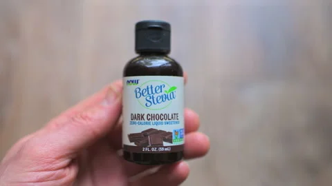 Stevia dark chocolate natural drops in bottle sweetener sugar substitute by Now Stock Footage 336783152